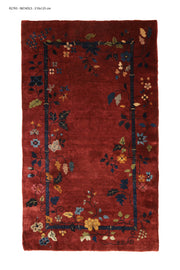 Antique Chinese decorative rug, 138x102 inches, featuring rich yellow and magenta hues with intricate Art Deco patterns.